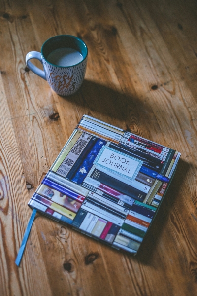 Coffee mug and book journal