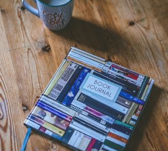 Coffee mug and book journal