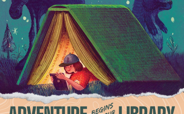 Kid reading in book tent during nighttime